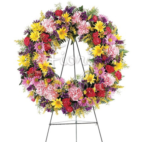 Ghirlanda funebre di fiori misti colorati con gambe sotto